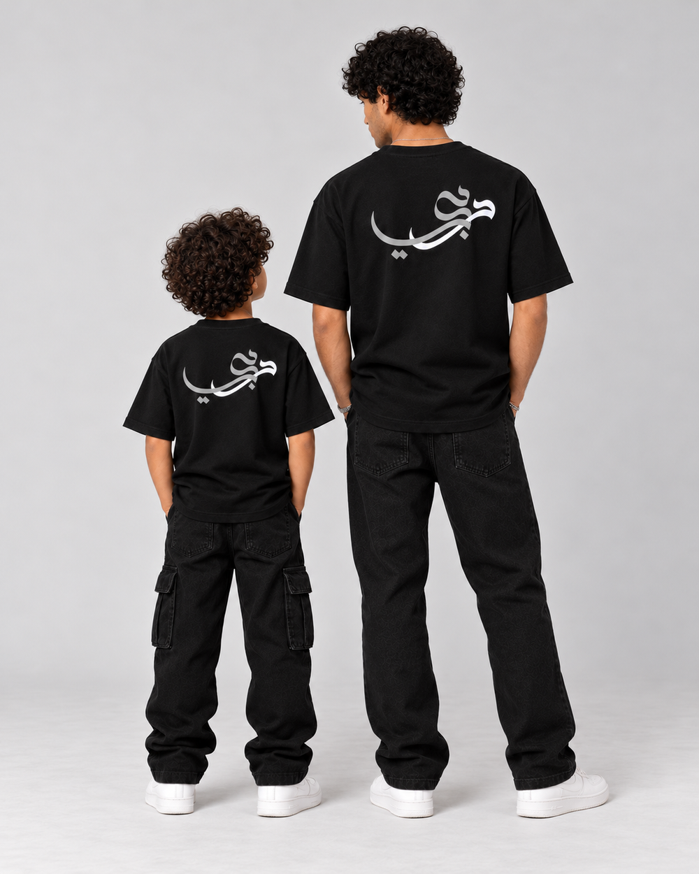 Kids Born in Dubai T-Shirt in Black – matching back calligraphy with adult tee