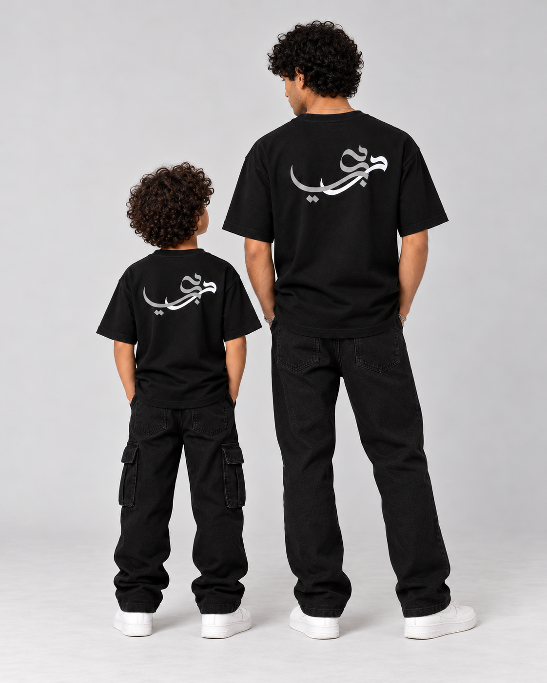 Kids Born in Dubai T-Shirt in Black – matching back calligraphy with adult tee