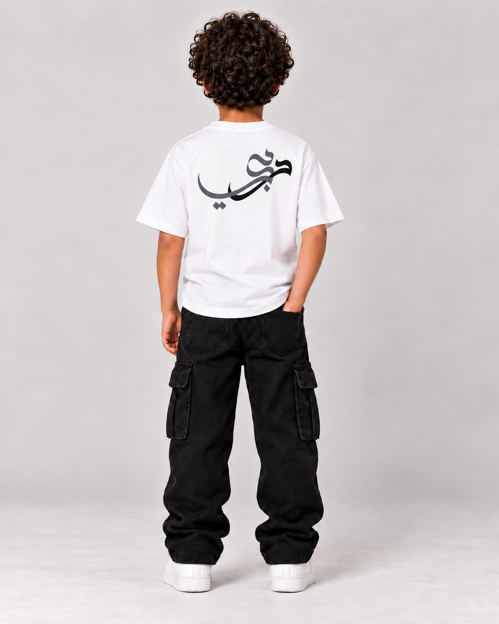 Kids Born in Dubai T-Shirt in White – back, Arabic Dubai calligraphy